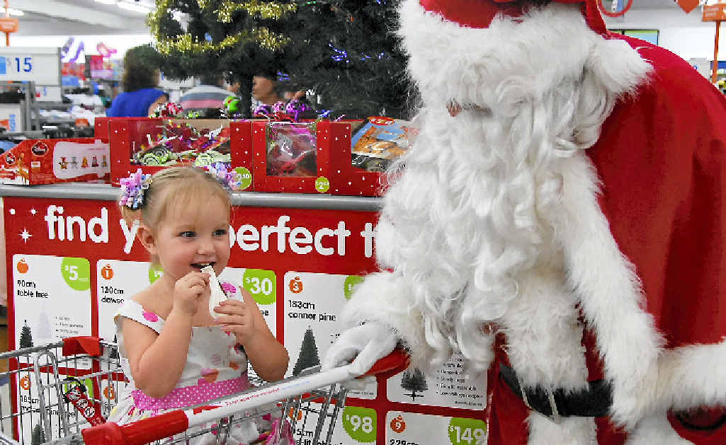 BELOW: Paige Davey, 3, with Santa Claus at Big W, Gladstone. BELOW: Paige Davey, 3, with Santa Claus at Big W, Gladstone.